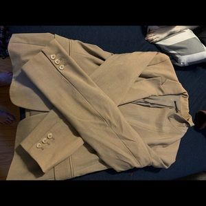 Beige blazer with padded shoulders